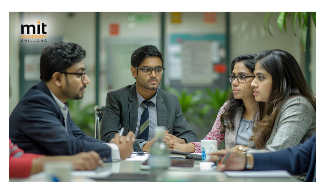 Faculty member guiding BBA students through a hands-on consulting exercise
