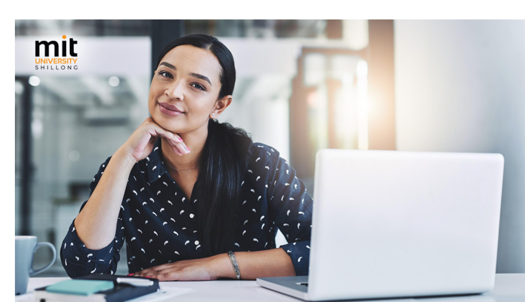 MIT Shillong BBA graduate working at a corporate desk